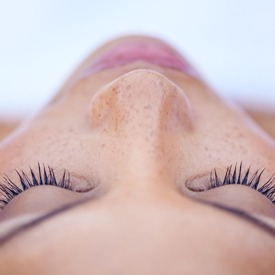 Cropped shot of an attractive young woman lying on her back
